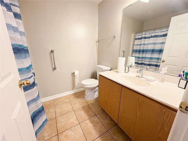 bathroom with tile patterned floors, vanity, and toilet