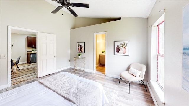 10543 Opus Dr, Riverview, FL 33579 - bedroom with light wood-type flooring, vaulted ceiling, baseboards, connected bathroom, and ceiling fan