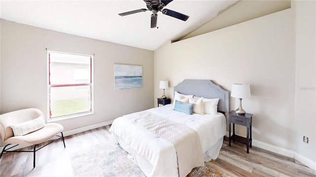 10543 Opus Dr, Riverview, FL 33579 - bedroom with light wood-style floors, vaulted ceiling, baseboards, and a ceiling fan