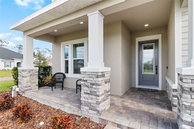 doorway to property with covered porch