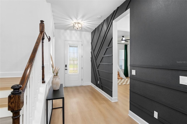 foyer featuring ceiling fan and light wood-type flooring