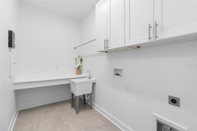 washroom with electric dryer hookup, cabinets, and washer hookup