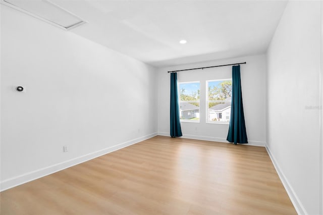 unfurnished room with light hardwood / wood-style flooring