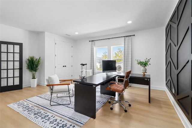 office space with light wood-type flooring