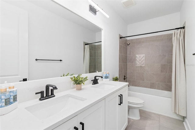 full bathroom featuring tile patterned floors, vanity, toilet, and shower / bathtub combination with curtain