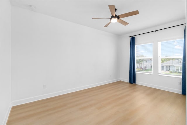 unfurnished room featuring light hardwood / wood-style flooring and ceiling fan