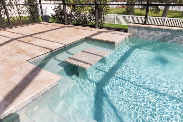 view of swimming pool with a patio area