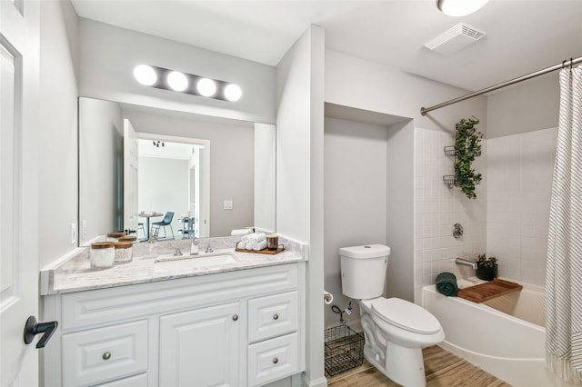 full bathroom with vanity, toilet, wood-type flooring, and shower / tub combo with curtain