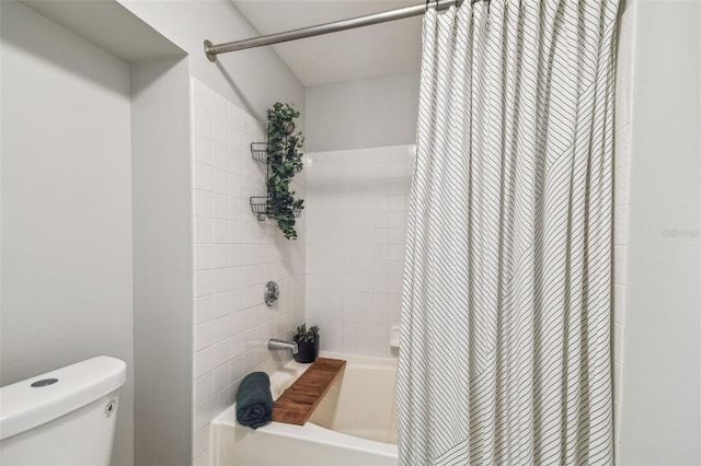 bathroom with shower / bath combo and toilet