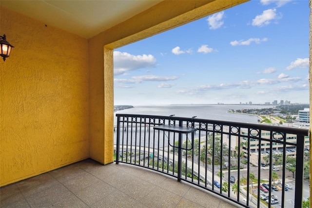 balcony featuring a water view