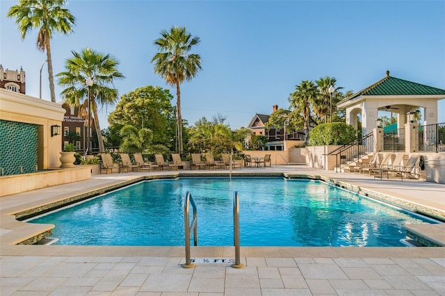 view of swimming pool with a patio