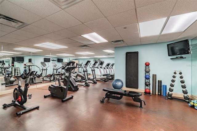 exercise room featuring a drop ceiling