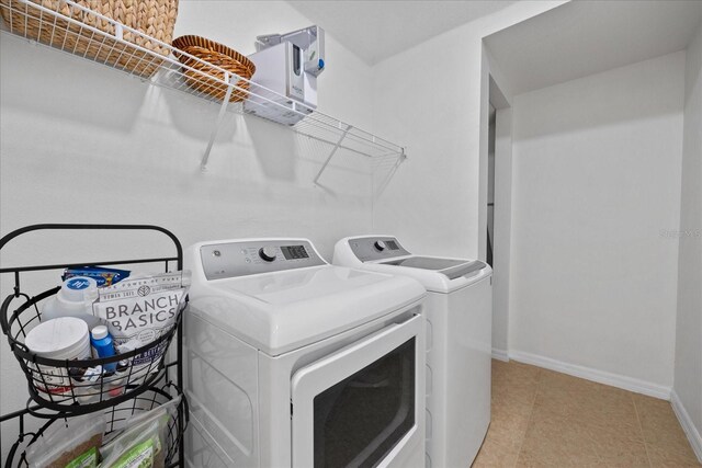 laundry area with washing machine and clothes dryer