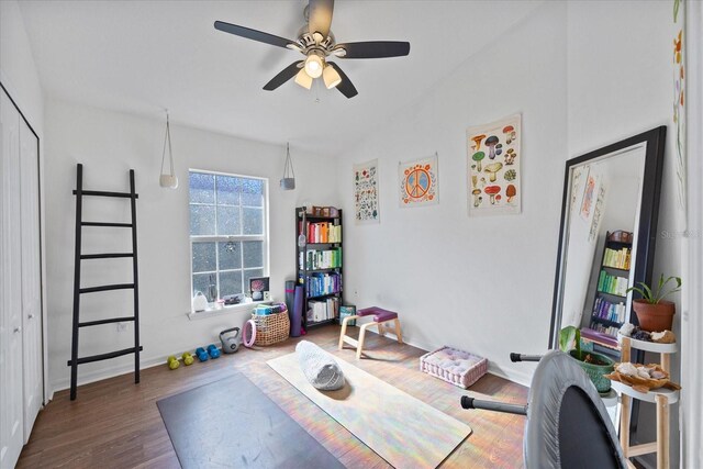 interior space with ceiling fan and dark wood-type flooring