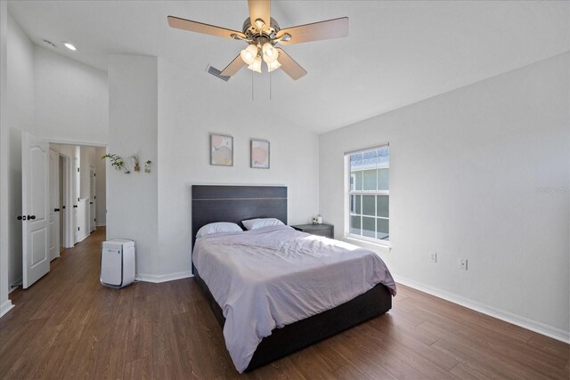 bedroom featuring ceiling fan, dark hardwood / wood-style floors, and lofted ceiling