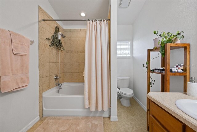 full bathroom with tile patterned floors, vanity, shower / tub combo, and toilet