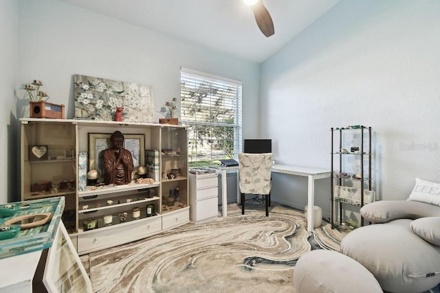 office area with ceiling fan and lofted ceiling