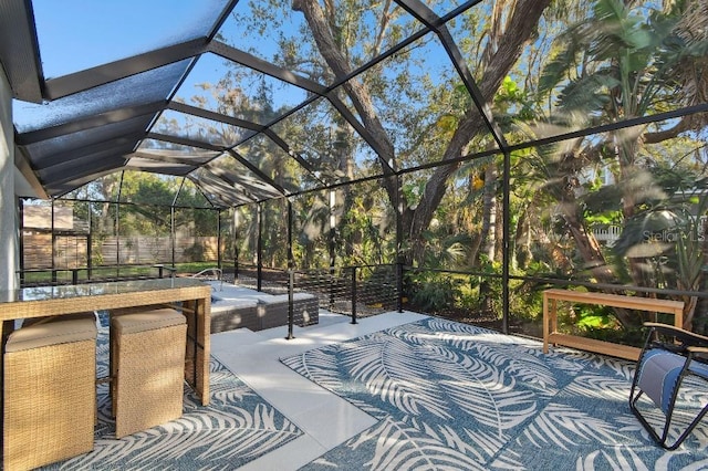 view of patio with glass enclosure