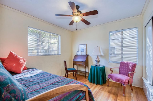 bedroom featuring a closet, ceiling fan, hardwood / wood-style floors, and ornamental molding