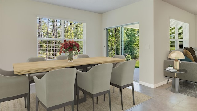 dining space with tile patterned flooring