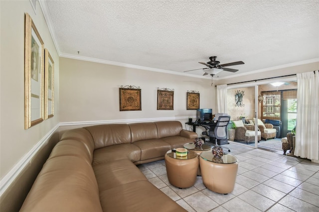 tiled living room featuring ceiling fan, a textured ceiling, and ornamental molding