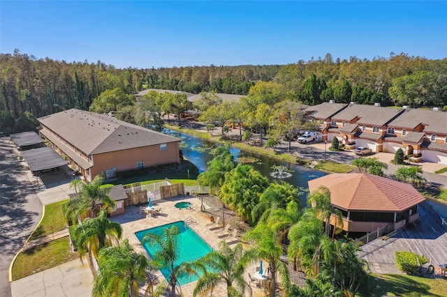 birds eye view of property featuring a water view