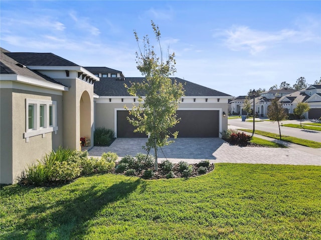 exterior space with a lawn and a garage