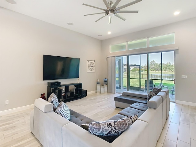living room with recessed lighting, baseboards, a ceiling fan, and wood finished floors