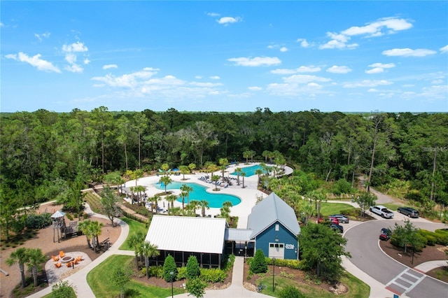 aerial view featuring a wooded view