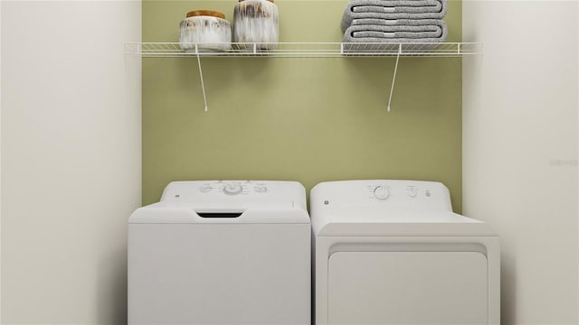 laundry room featuring washer and clothes dryer