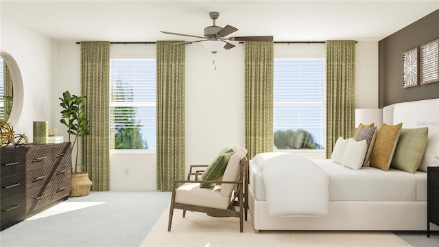 carpeted bedroom featuring ceiling fan and multiple windows