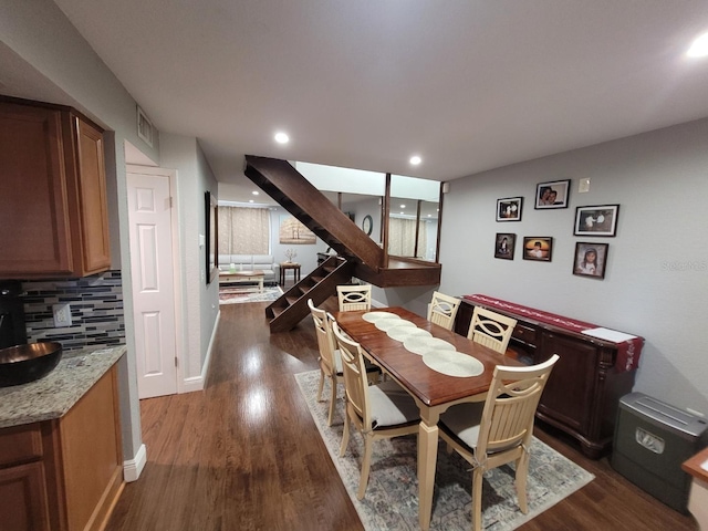 dining space featuring dark hardwood / wood-style floors