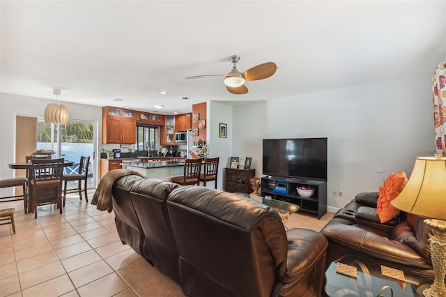 living room with recessed lighting, ceiling fan, and light tile patterned floors