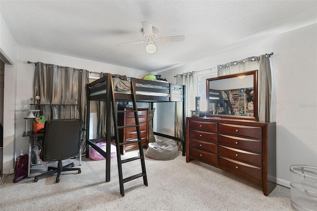 bedroom featuring baseboards, a textured ceiling, and speckled floor
