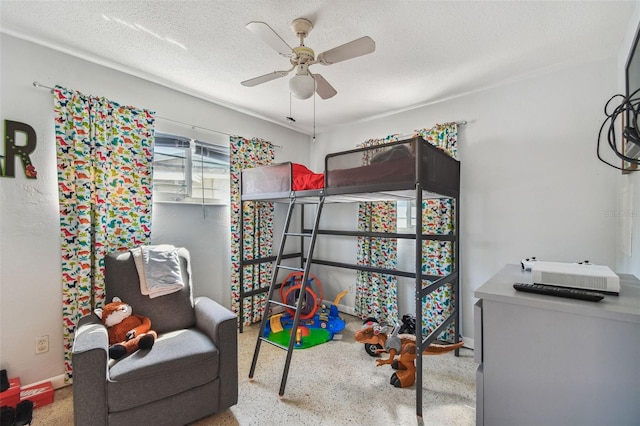 bedroom with speckled floor, a ceiling fan, and a textured ceiling