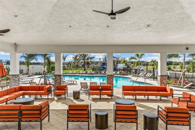16026 10th Ave E, Bradenton, FL 34212 - view of patio with an outdoor living space, a ceiling fan, and a community pool