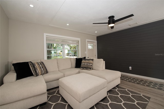 living room with hardwood / wood-style floors and ceiling fan