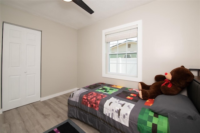 bedroom featuring ceiling fan and light hardwood / wood-style flooring