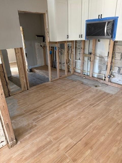 interior space featuring white cabinets and light hardwood / wood-style floors