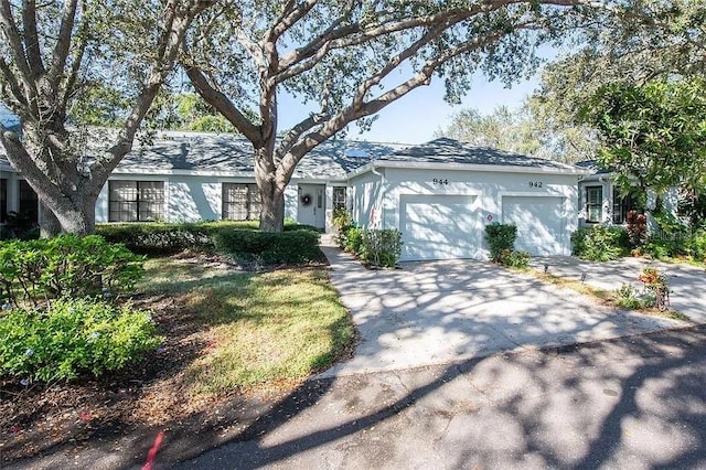 ranch-style home featuring a garage