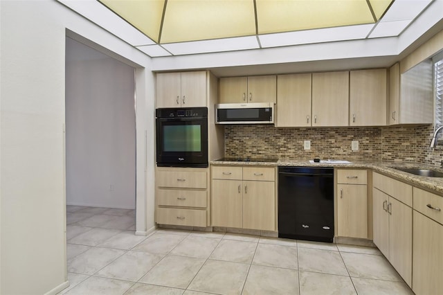 kitchen featuring light brown cabinets, black appliances, and sink