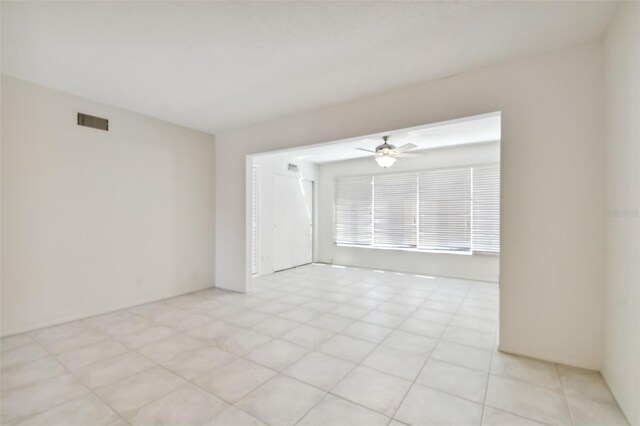 unfurnished room with ceiling fan