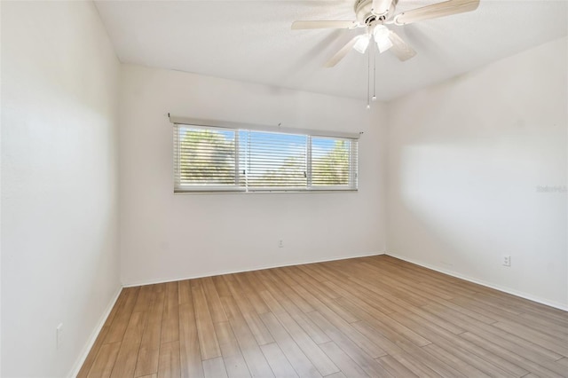 unfurnished room with a wealth of natural light, ceiling fan, and light wood-type flooring