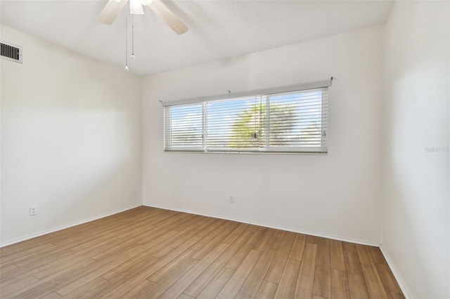 spare room with ceiling fan and light hardwood / wood-style flooring