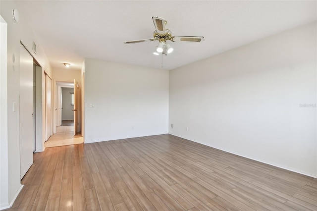 unfurnished room featuring ceiling fan and light hardwood / wood-style flooring