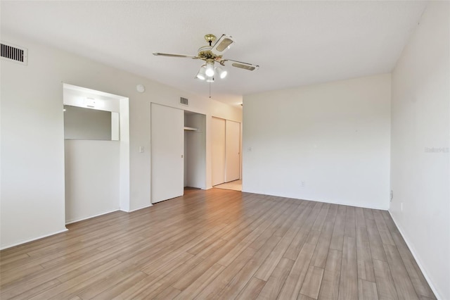 unfurnished bedroom featuring ceiling fan and light hardwood / wood-style floors