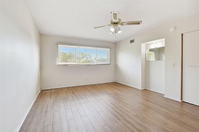 unfurnished room featuring ceiling fan and light hardwood / wood-style flooring