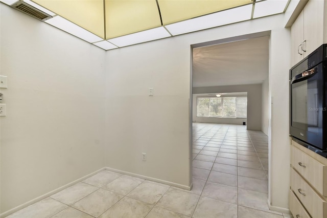 interior space with light tile patterned floors