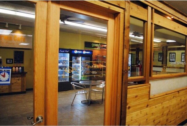 interior space featuring wooden walls