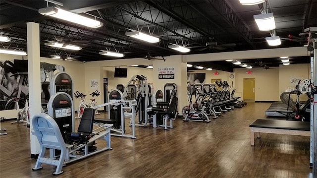 exercise room with wood-type flooring